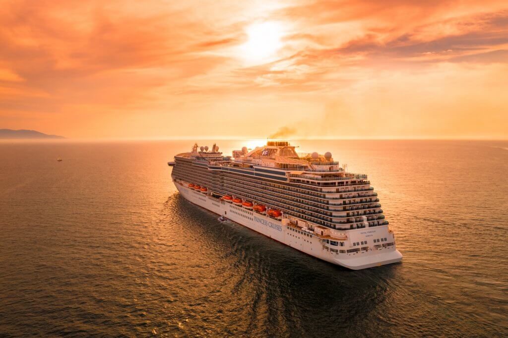 cruiseship sailing off into the sunset in mexico