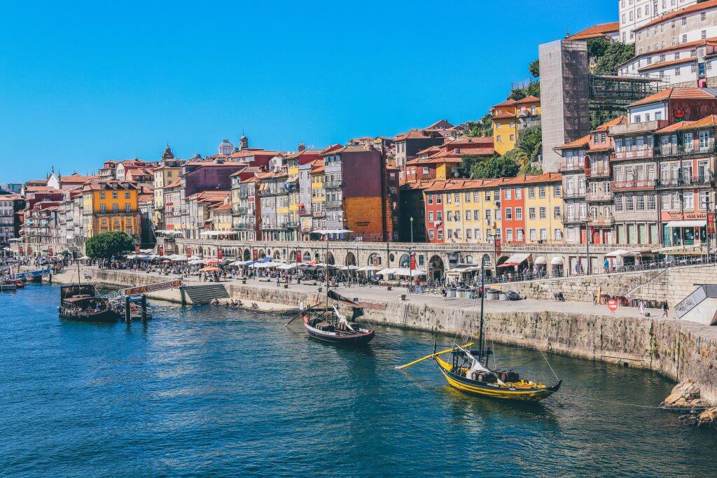 Porto, Portugal waterfront with small boats and colorful buildings