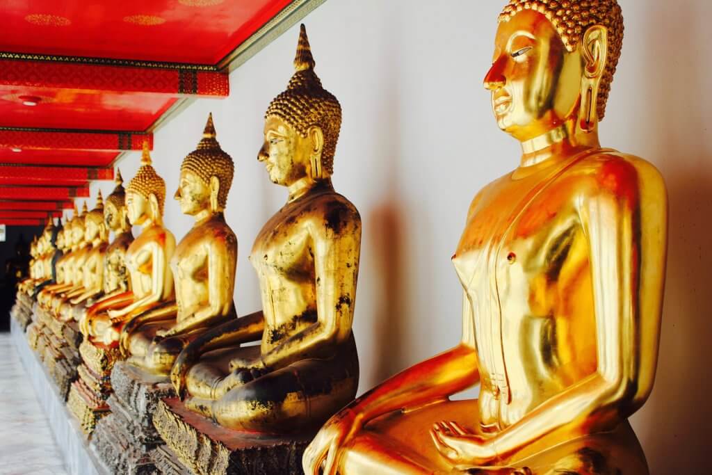 Golden buddha statues at Wat Pho in Bangkok Thailand
