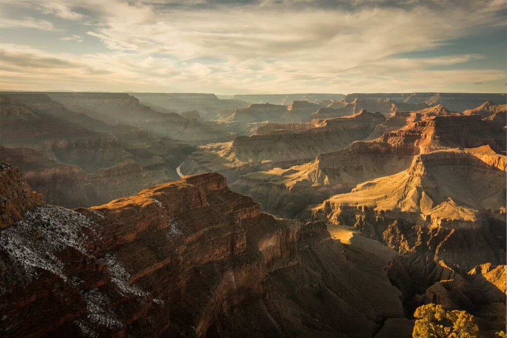 the sun rising over grand canyon national park