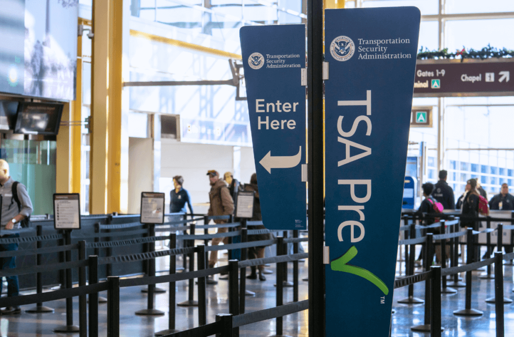 TSA Precheck sign at airport for story on Global Entry vs. TSA PreCheck vs. CLEAR