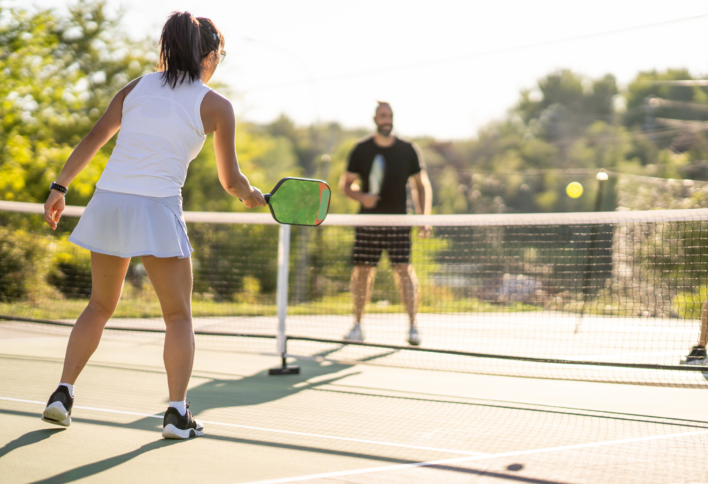 couple playing pickleball