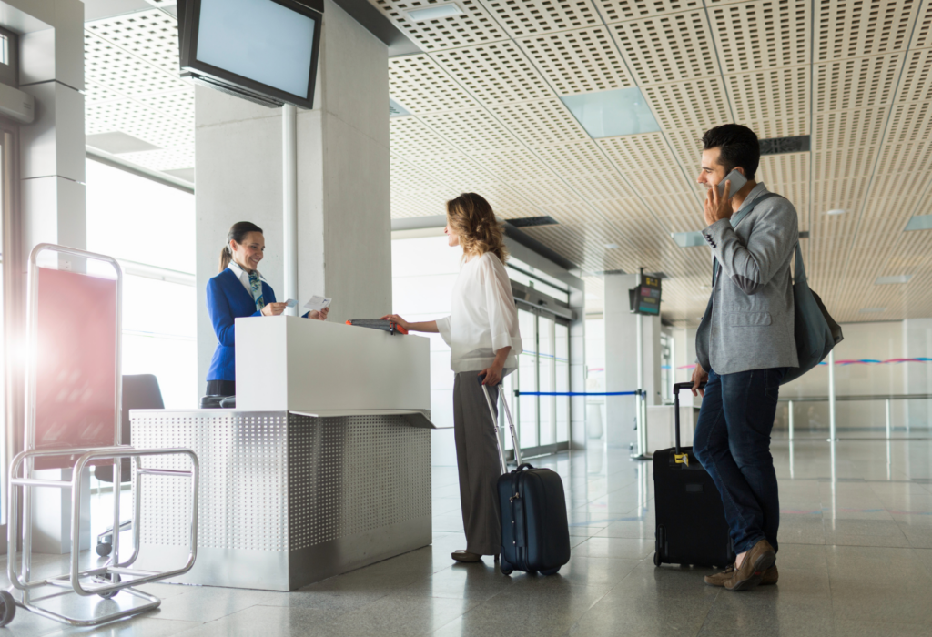 people in line at airport gate | how to decide between nonstop or 1 stop for a 12-hour fligh